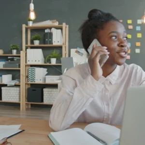 Assistant on a call at a desk in Nairobi