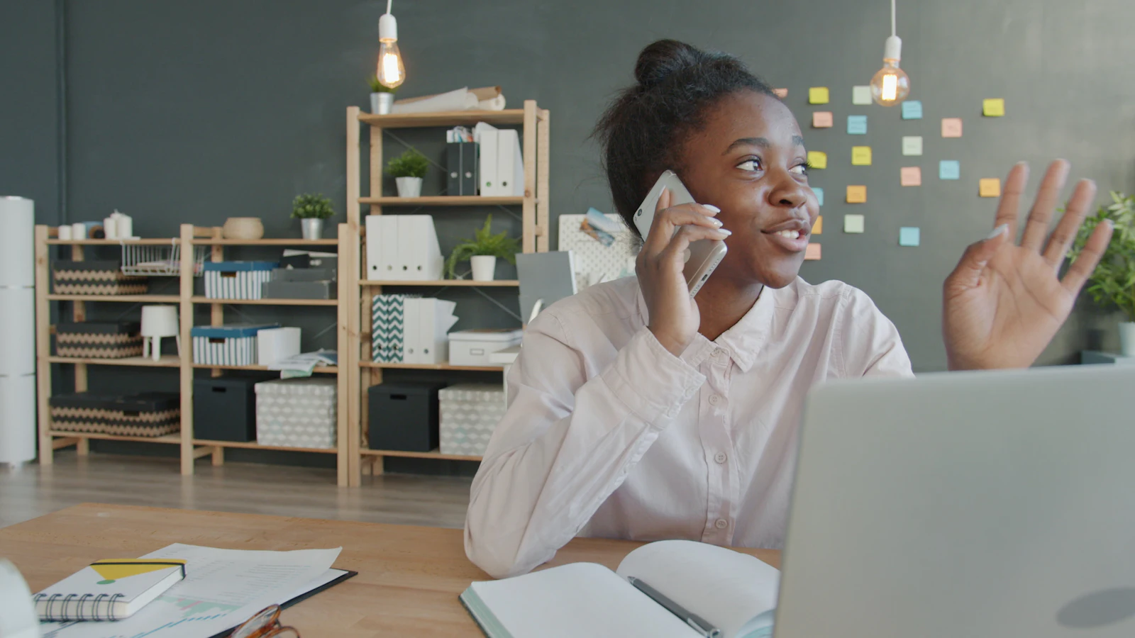 Man on the phone in Nairobi giving a client an update on errands in Kenya